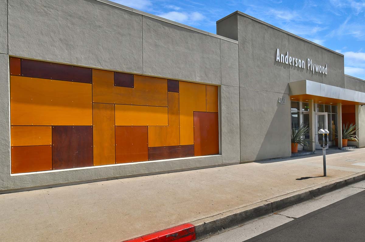 Marine-grade plywood in various shapes and stained in different colors creates a piece of art for the building’s front.